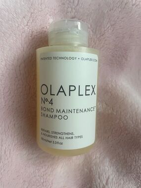 OLAPLEX No.4 Bond Maintenance Shampoo — White Bottle with Pale Yellow Liquid
